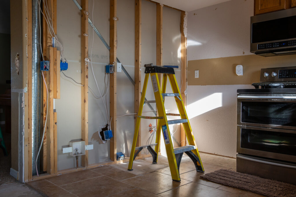 Unfinished kitchen wall remodel home improvement for sound proofing