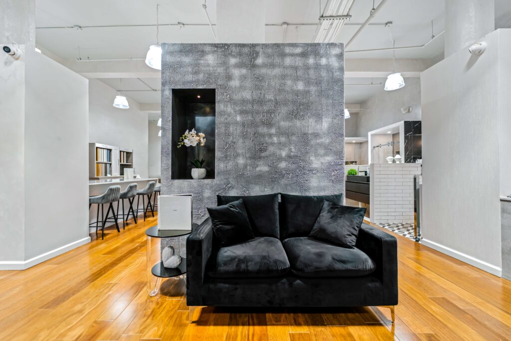 Grey Wall and Couch Klein Kitchen and Bath Showroom