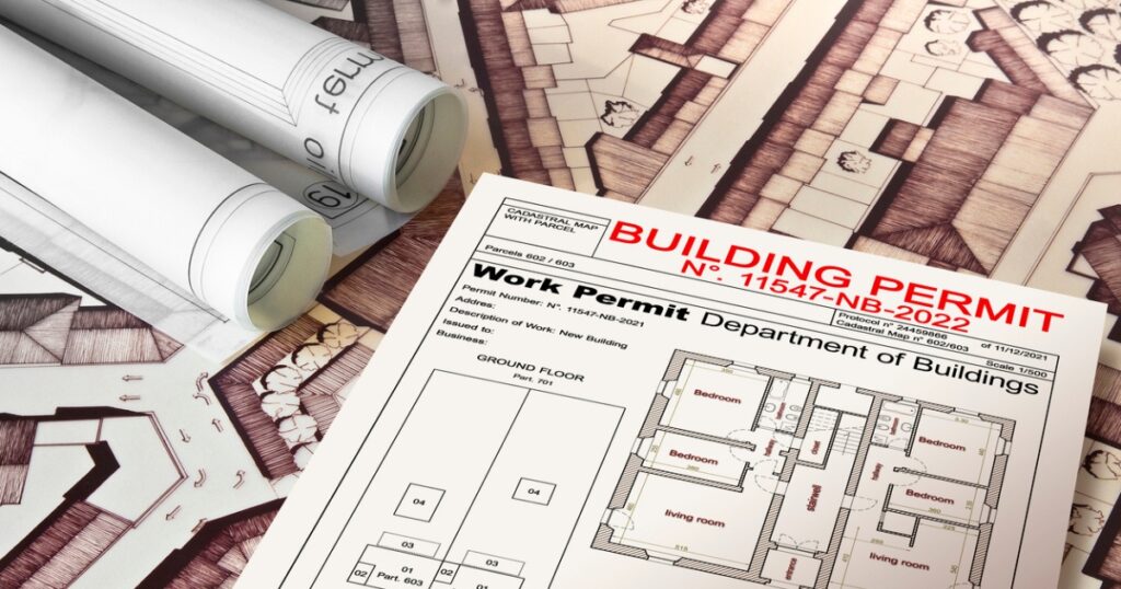 Building permit documents and architectural plans for a residential renovation project