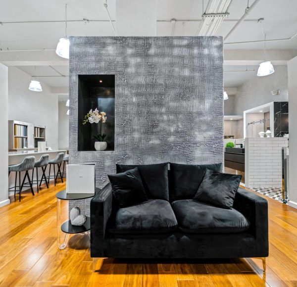 Grey Wall and Couch Klein Kitchen and Bath Showroom