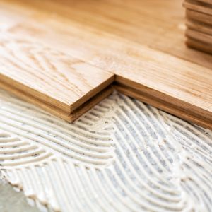 Closeup of parquet sockets for alignment precision pointing to the direction of  floor plates placement